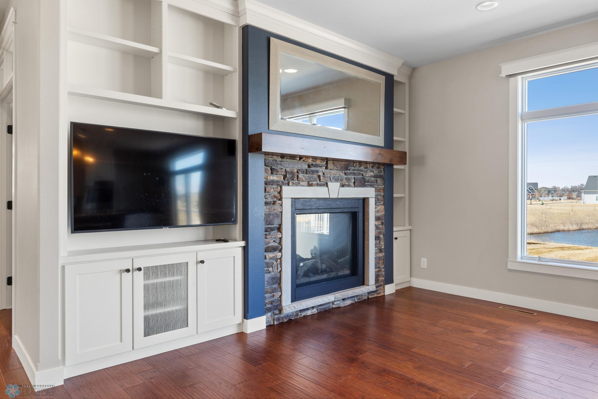 2 sided gas fireplace and built-ins