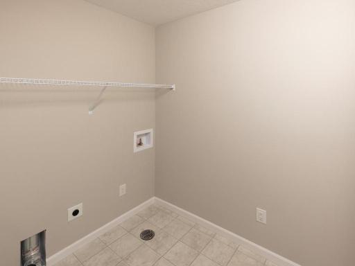 Photo taken of different home with similar plan & finishes. Upper level laundry room.