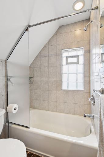 Owner's Suite Private 3/4 Bath: Ceramic Tile Walls, Ceramic Flooring, Vented Glass Block Privacy.