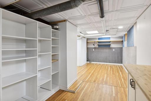 Lower Level Workshop: Laminate Flooring, Recessed Lighting, Built-in Storage, Cedar Lined Walk-in Closet.
