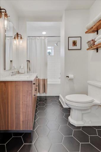 Spacious layout with great vanity / storage and full bath with shower