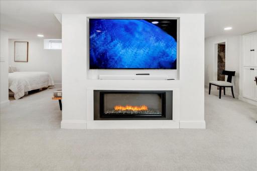 Linear burning fireplace and built in TV alcove with smart technology
