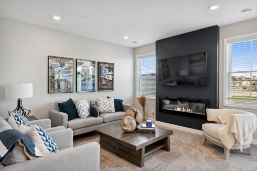(Photo of a decorated model, actual homes finishes will vary) The comfortable Great Room offers a natural gathering space, located among the open floorplan.