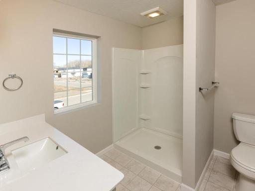 Photo taken of different home with similar plan & finishes. Primary Bath