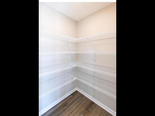 Photo taken of different home with similar plan & finishes. Kitchen walk-in pantry.