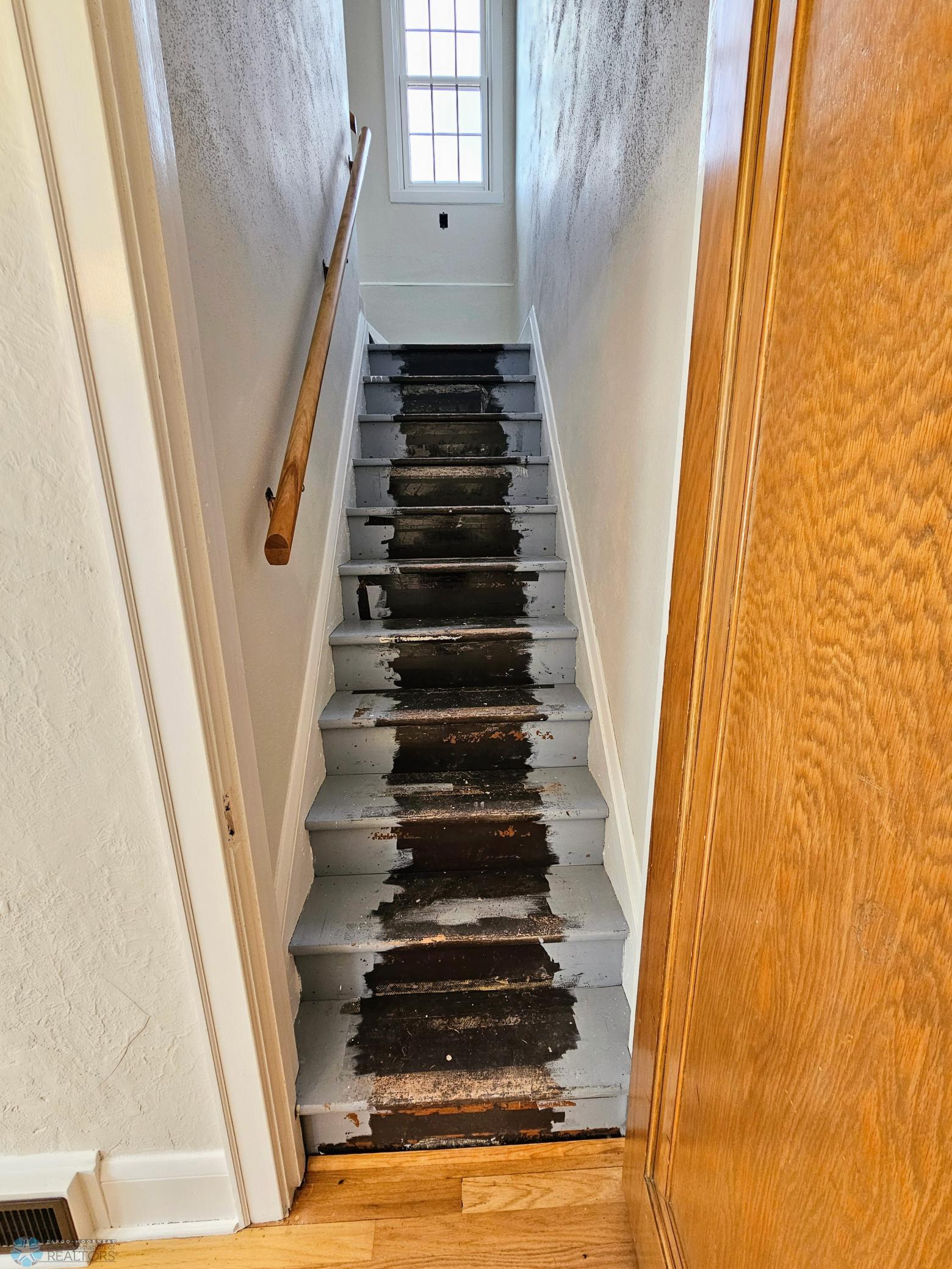 Stairs to second floor off of dining room