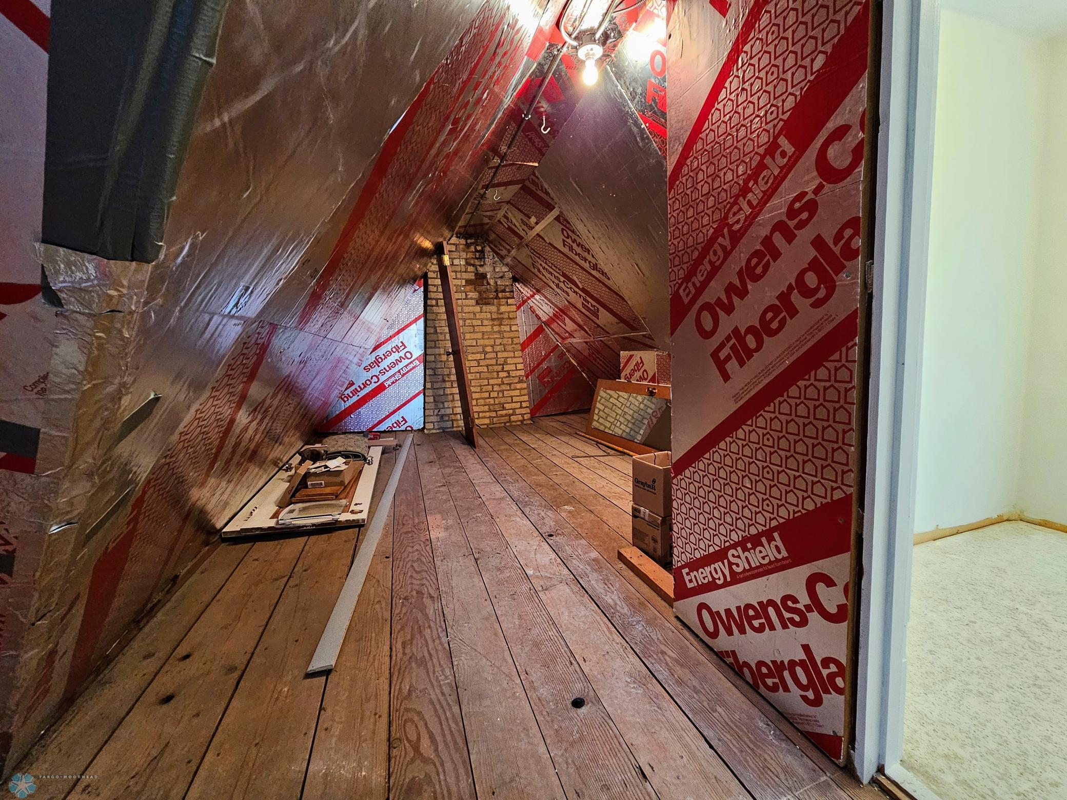 Unfinished attic space, located through closet
