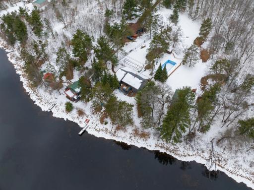 An aerial view of the property showings the amenities and parking.