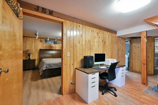 Open lower level area has access to three quarter bath, laundry/storage area and bedroom.