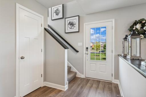 (Photo of a decorated model, actual homes finishes will vary) Make the best first impression with this bright and open foyer!