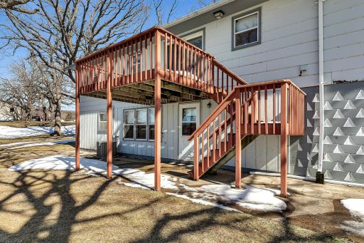 Large deck and walkout lower level to concrete patio.