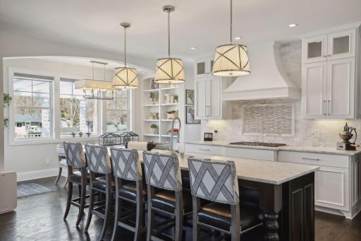Honed marble center island is spacious and easily seats five