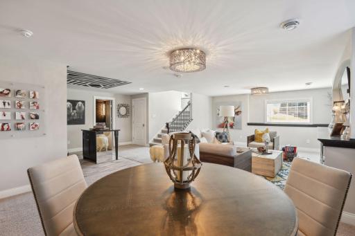 Wide Stairway brings you down to this open, bright entertainment space