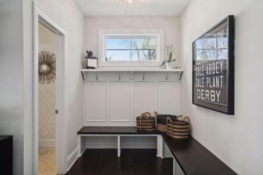 Mud room with bench and hooks and large closet