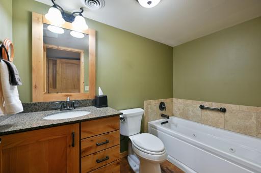 The bathroom on this level is fabulous! It has a granite vanity, a whirlpool tub, a separate shower and a sauna.
