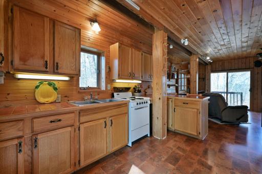 The kitchen has great storage and an electric stove.