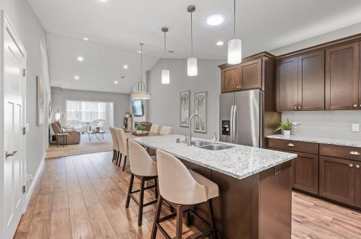 Stunning open floorplan with impressive vaulted ceilings. Updated lighting!