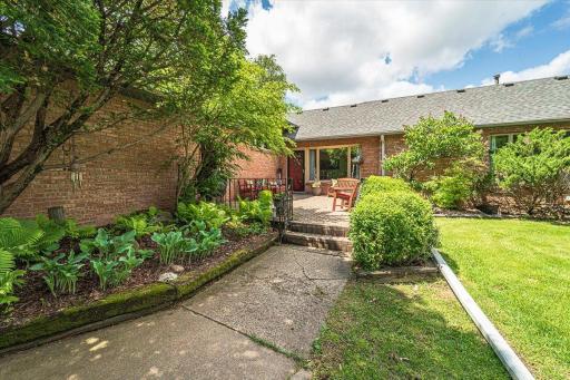Perennial beds surround the home and line the walkways as you enter the home on one of two paver decks!