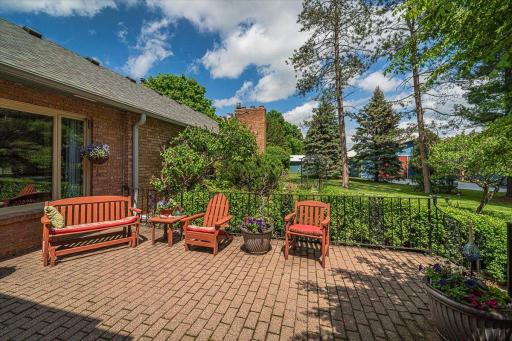 From the paver patio deck, you can see the stable beyond.