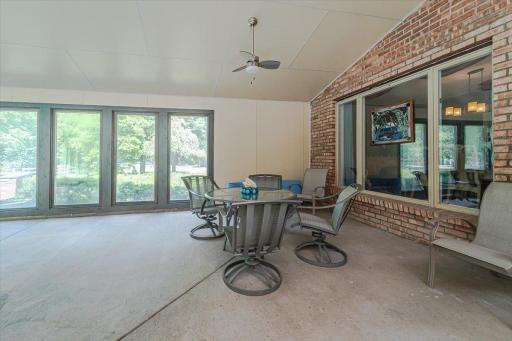 There is space for your indoor patio set, for meals and afternoons by the pool.
