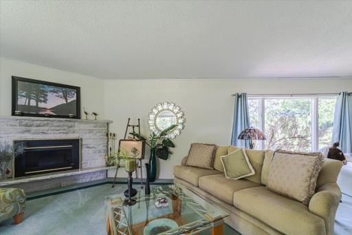 Another view of the family room with its corner stone, gas fireplace.