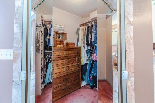 Primary suite walk-in closet - This is one of two closets.