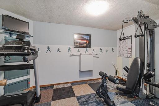 A 9âx14â exercise room lies off the lower level hall.