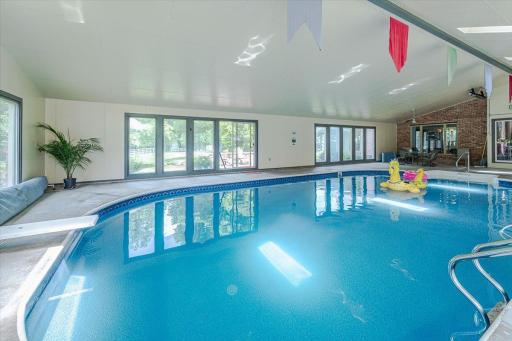 The pool room takes in sweeping views of the yard, gardens and setting.
