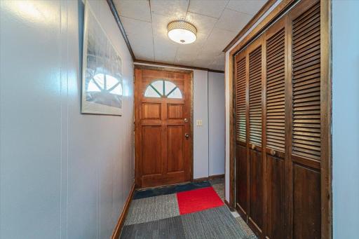 This office connects to a back hall with access to the exterior.