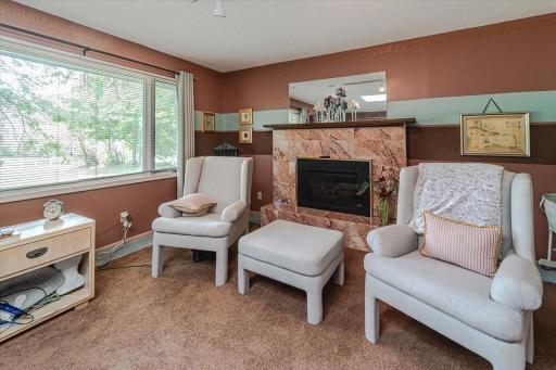 The primary suite includes this fireplace that anchors the room.