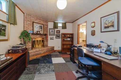 There is also this 11â x 16â den/office area with a wood burning fireplace and 3/4 bath.