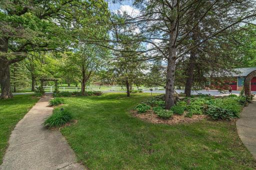 This walkway leads from the home to the stables (left) or the garage outbuilding (right.)
