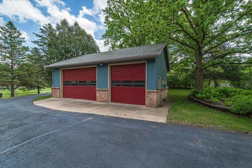 The 35' x 23' garage outbuilding is heated and insulated, with a cement floor, 10' doors, plus access for a semi-tractor from the rear. It has 200AMP electrical.