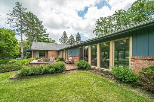 This patio deck lies off the pool room, and overlooks the backyard, with panoramic views.