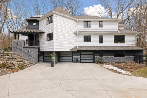 Concrete driveway features french drains.