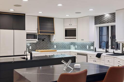Quartz tops with waterfall edges on the islands.