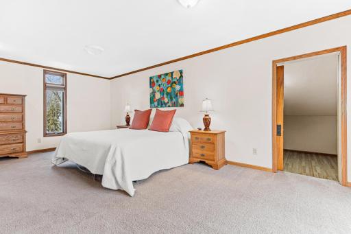 Beautiful upper level primary suite features two spacious walk-in closets!