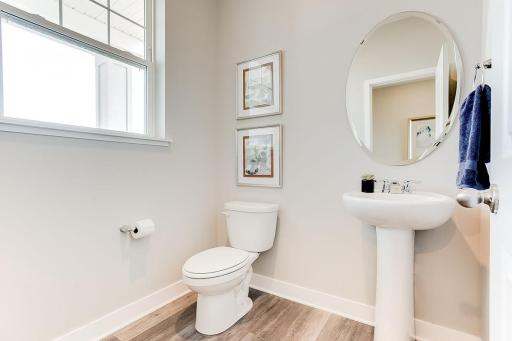 The main level powder bath is wonderful for guests! MODEL HOME PHOTOS! COLORS AND SELECTIONS MAY VARY.