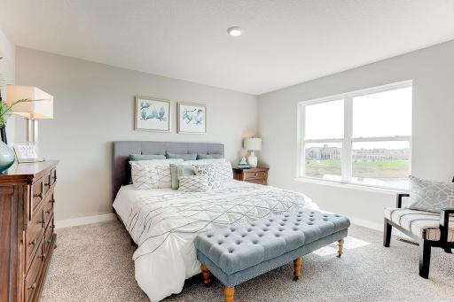 The primary bedroom is full of natural light and space. MODEL HOME PHOTOS! COLORS AND SELECTIONS MAY VARY.