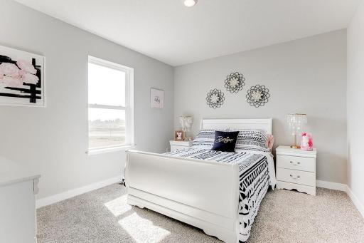 The additional two bedrooms upstairs have natural lighting. MODEL HOME PHOTOS! COLORS AND SELECTIONS MAY VARY.