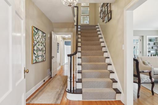 Gorgeous front hall and staircase greet you as you step inside.