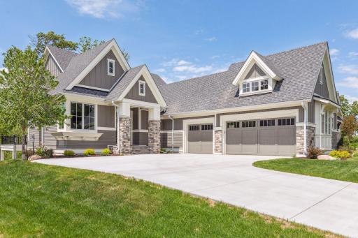 Gorgeous rambler home with main-level living & private nature views.