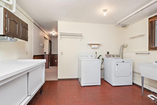 Large Laundry Room in lower level with utility sink