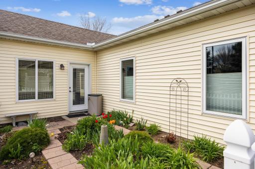 Door to 4 season sunroom, garden area.