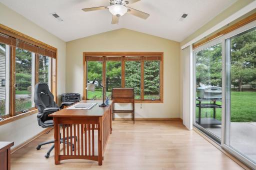 Endless possibilities for the sun room, currently being used as an office