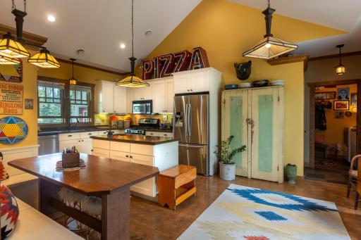 The kitchen is a culinary haven with updated stainless-steel appliances.