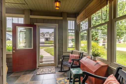 Step into the charming enclosed three-season porch that warmly welcomes you and adds an extra touch of character to the property.