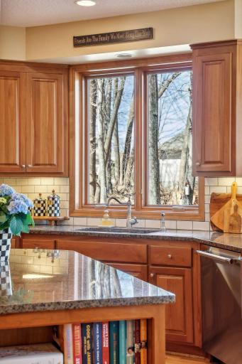 Entertain in style with your two granite islands in the kitchen, an oversized window and subway tile backsplash