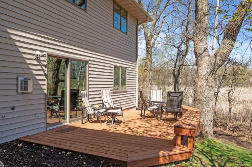 Spacious deck just outside the walkout on the lower level overlooking the pond.