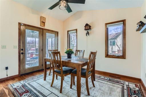 The dining room provides ample space for meals with easy access out to the 3-season porch from here!
